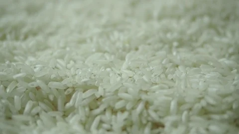 Female hand picks dry white rice grains for cooking Stock Footage 110791153