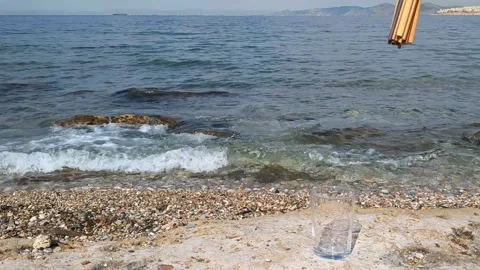 Female hand picks up plastic straws from glass and puts back biodegradable Stock Footage 310367233