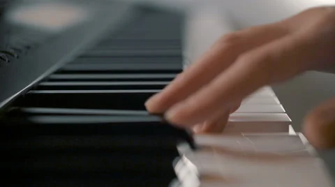 Female hand playing electric keyboard Stock Footage 69021900