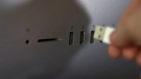 Female hand plugging in a white USB 3.0 Stock Footage 127319673
