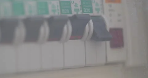 Female hand pressed to button of automatic circuit breaker Stock Footage 67231484