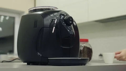 Female hand presses button of the coffee machine and begins preparation of drink Stock Footage 71766521