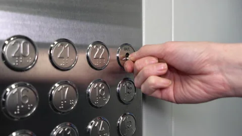 A female hand presses a button in the elevator. Stock Footage 147346534