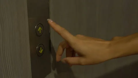 Female hand presses the elevator call button Stock Footage 91838831