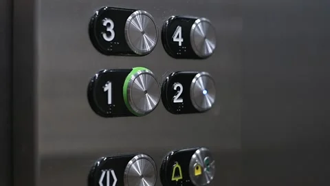 Female hand presses the elevator call button. Index finger of hand presses Stockbeeldmateriaal 218610310