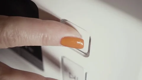 Female hand presses the power button Stock Footage 73006196