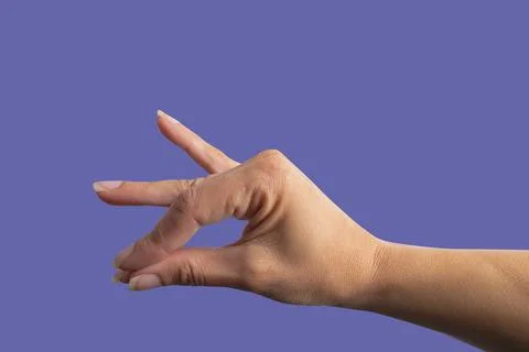 Female hand on purple background, joining fingers Stock Photos