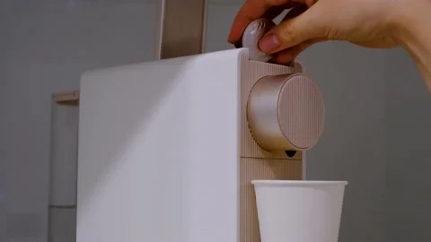 Female hand to put a capsule in the coffee machine close-up. Stock Footage 221379609
