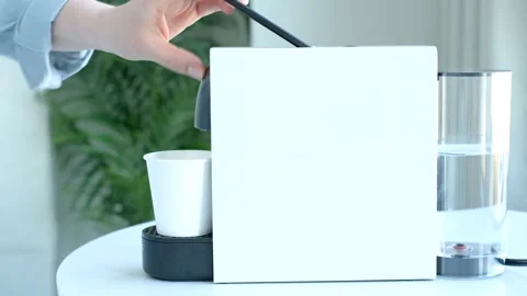 Female hand to put a capsule in the coffee machine close-up, side view. Stock Footage 234961185