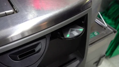 A female hand puting AU $5 note into self-service checkout machine. Stock Footage 78479038