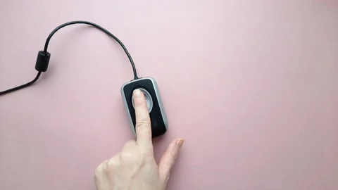 Female hand puts index finger on the fingerprint scanner Stock Footage 167478449