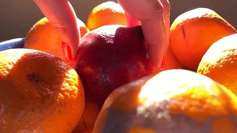 Female hand putting down fruit in slow motion Stock Footage 124941798