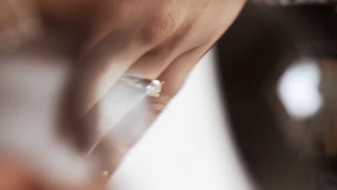 Female hand with a ringlet through a magnifying glass Stock Footage 129085116