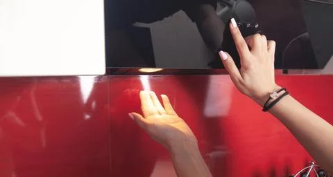 Female hand select program at modern cooking hood. Stock-Fotos