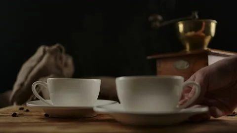 Female hand serves second modern coffee cup. Rotating wood table. Dolly shot Stock Footage 140365190