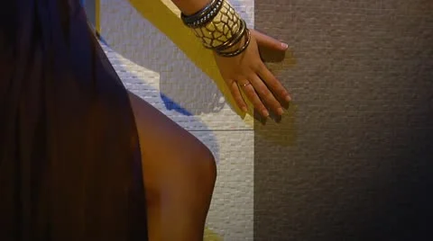 Female hand is sexually touching the wall Stock Footage