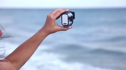 Female hand shooting video with Sony Action Cam Video stock 80361908