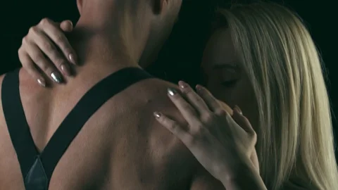 Female hand slowly touching back of young muscular man Stock Footage 86993268
