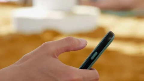 Female hand with smartphone closeup Stock Footage 77809366