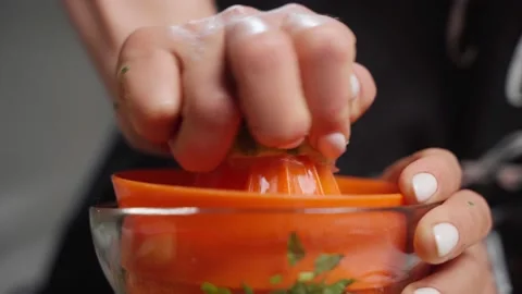 Female hand squeezing lime. Close up. Stock Footage 130792286