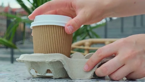 Female hand take Two paper cups with lid for tea to go. Coffee take away on the Stock Footage 237053647