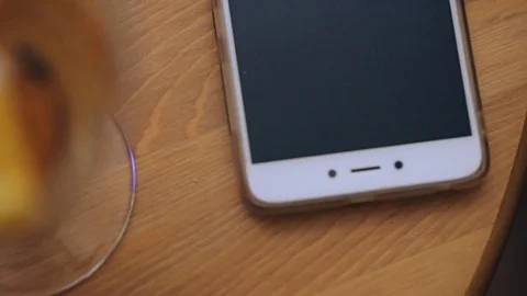 Female hand taking cocktail from table Video stock 82496463