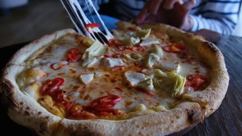 Female hand taking slice of hot vegitarian pizza. Stock Footage 242391804