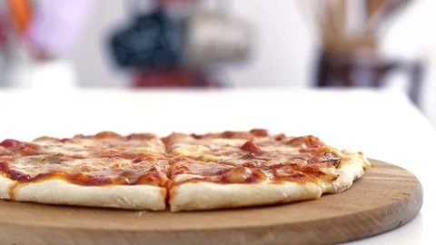 Female hand taking slice of pizza from the table. Stock Footage 88632286