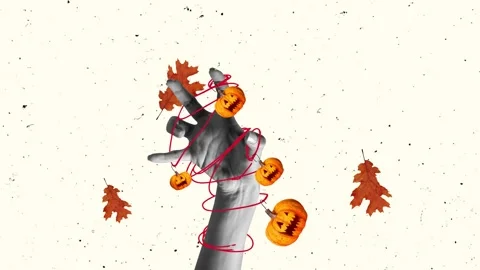 Female hand tangled in string with carved pumpkin and autumn leaves. Halloween Stock Footage 251704872