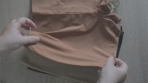 Female hand testing elasticity seamless panties, Woman choosing delicate un.. Stock Footage 327487496