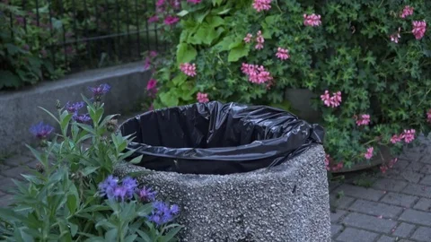 Female hand throwing away garbage in the trash. slow motion Stock Footage 113060742