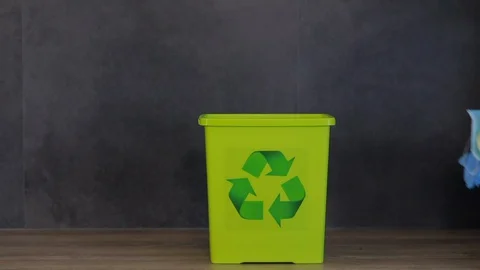 A female hand throws used face masks into a trash Stock-Footage 129341795