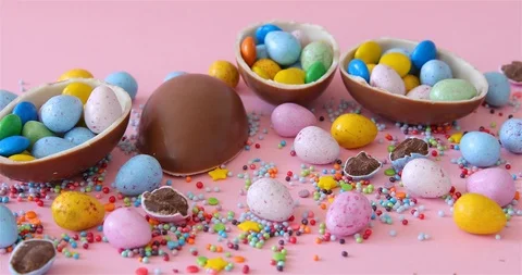 Female Hand Took Easter junk-food, chocolate eggs Stock Footage 126608486