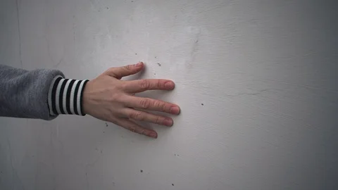 Female hand touch a plastered wall. Stock Footage 107532816