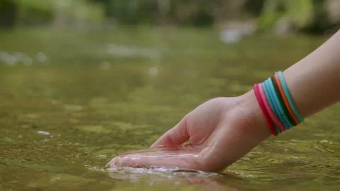 Female Hand Touching River Flow. Hands With Pure Spring Water. Crystal Clea.. Stock Footage 331957692