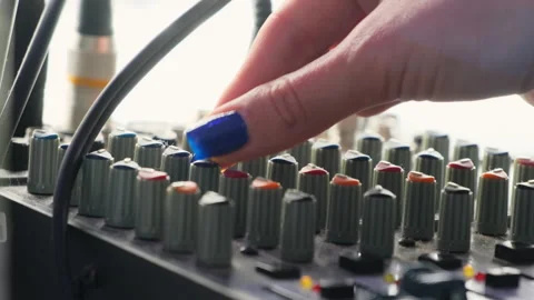Female hand turns rotary knobs on mixer console in studio 스톡 동영상 274144623