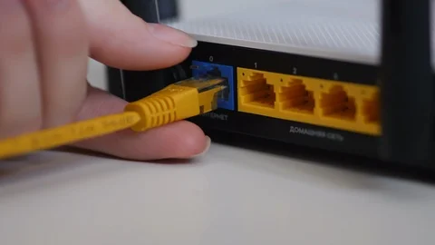 female-hand-unplug-ethernet-cable-footage-086713049_iconl.jpeg