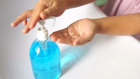 Female hand using alcohol gel. prevent against infection of Covid-19 outbreak Stock Footage 127487053