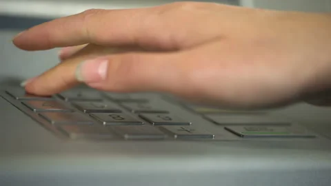 Female hand using ATM, inserting unique personal code and pressing enter button Stock Footage 90896434
