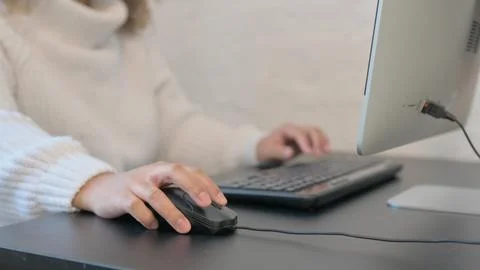 Female Hand Using Computer Mouse for Work Stock Photos
