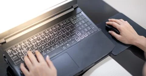 Female hand using the laptop while stay at home due to the Covid epidemic, .. Foto stock