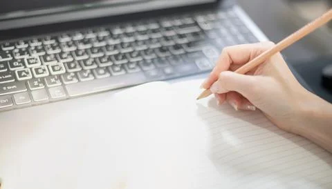 Female hand using the laptop while stay at home due to the Covid epidemic, .. Foto stock