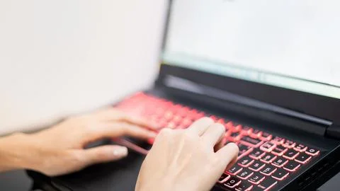 Female hand using the laptop while stay at home due to the Covid epidemic, .. Foto stock