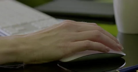 Female hand using mouse moves to keyboard Stock Footage 68447057
