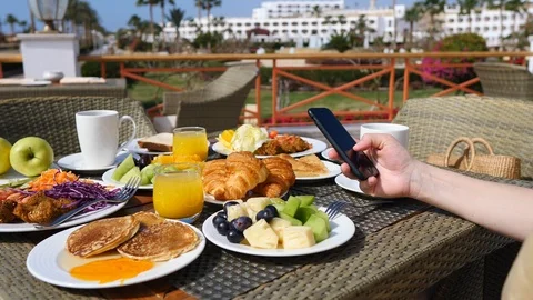 Female Hand Using Smartphone While Having Breakfast Outdoors Stock Footage 106970462