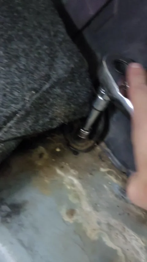 Female Hand Using Socket Wrench to Tighten Bolt on Car DIY Auto Repair Stock Footage 247794615