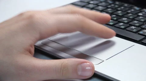 Female Hand Using a Touchpad Mouse on Laptop. 4K Stock Footage 46405750