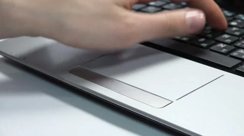 Female Hand Using a Touchpad Mouse and Typing on a Laptop Keyboard. 4K Stock Footage 46406110