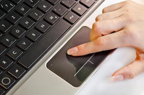 Female hand using track pad on a laptop Stock Photos