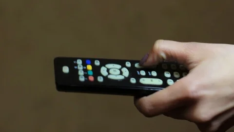 Female hand using TV remote Close-up Stock Footage 119384719
